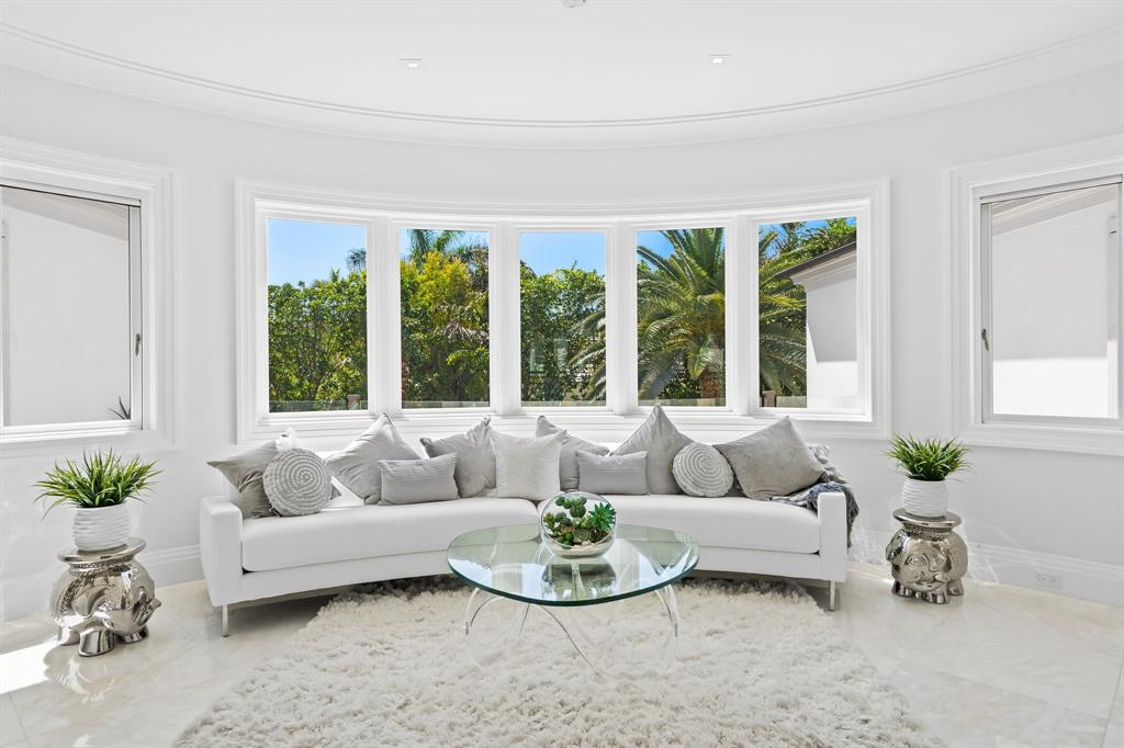 150 Kings Road Palm Beach, FL 33480 - Photo 16 of 45 a living room with furniture and a large window