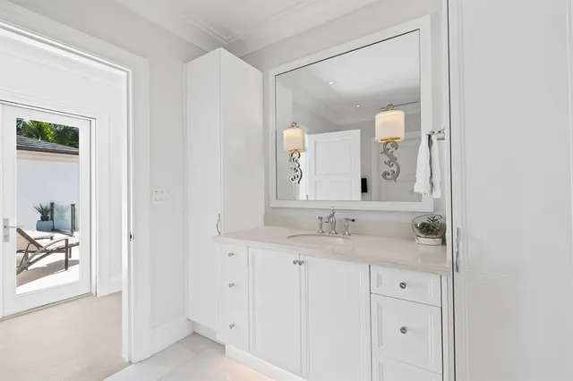 a view of a hallway with wooden floor and stairs
