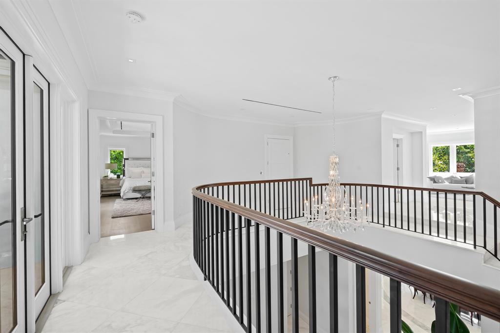 150 Kings Road Palm Beach, FL 33480 - Photo 24 of 45 a view of a hallway with wooden floor and a dining room