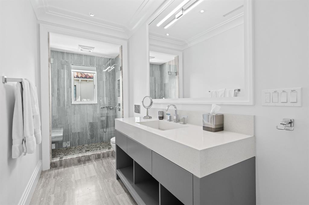 150 Kings Road Palm Beach, FL 33480 - Photo 28 of 45 a bathroom with double vanity sink and a mirror