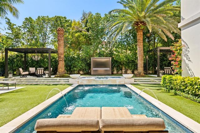 a view of an chairs and table in the patio