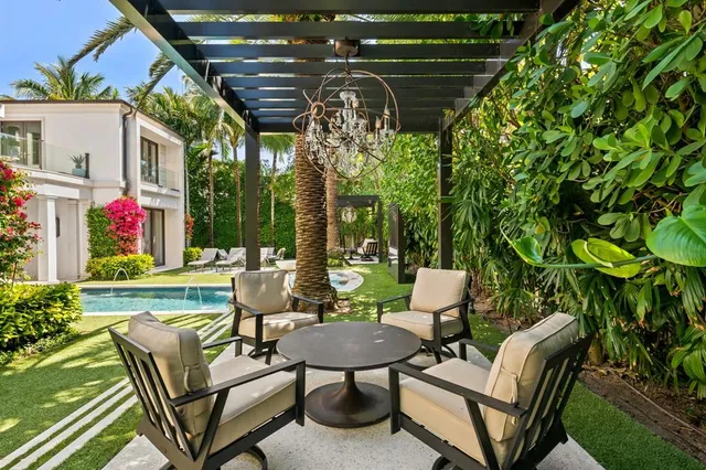 a view of a patio with swimming pool table and chairs