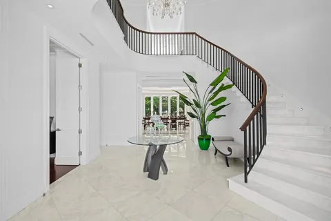 a view of a dining room and livingroom with furniture window and outside view