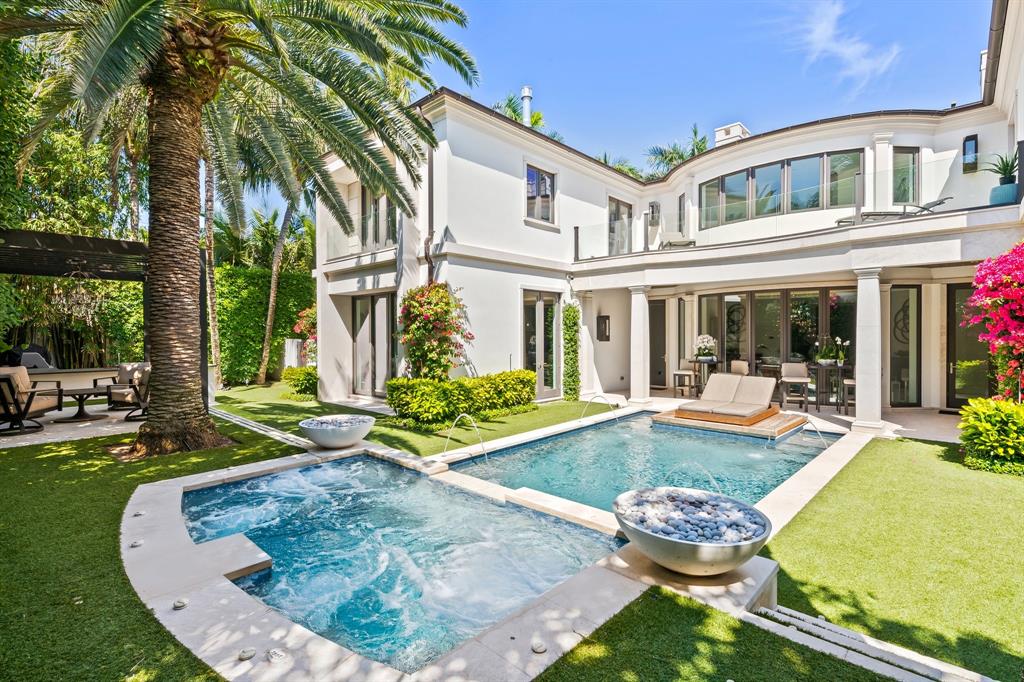 150 Kings Road Palm Beach, FL 33480 - Photo 41 of 45 a view of a house with swimming pool and porch
