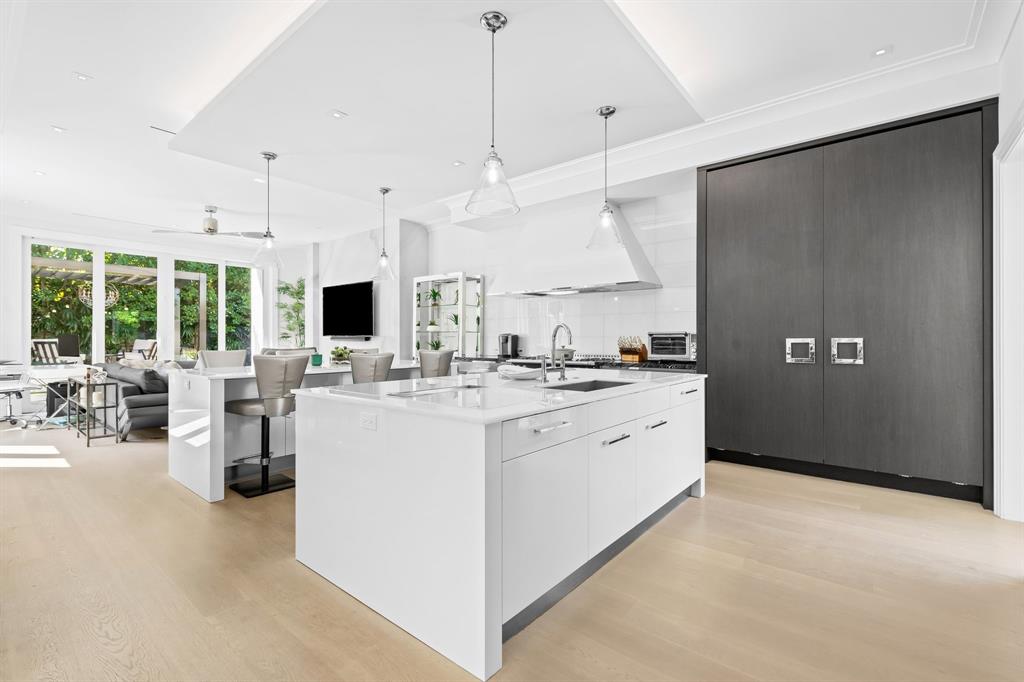 150 Kings Road Palm Beach, FL 33480 - Photo 7 of 45 a large white kitchen with lots of counter space and refrigerator