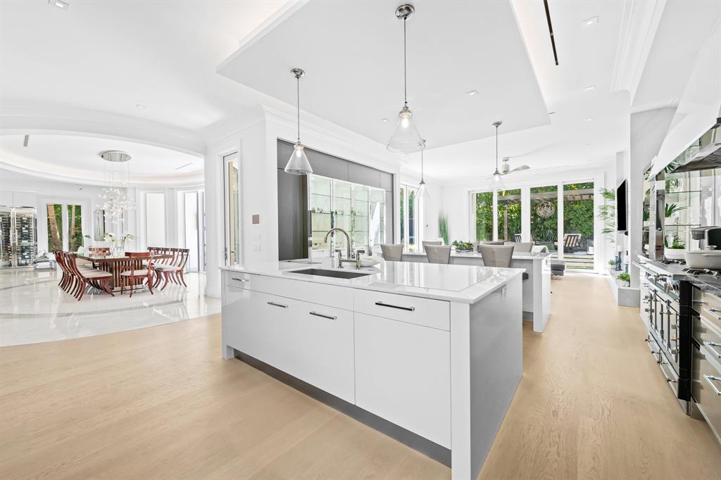 150 Kings Road Palm Beach, FL 33480 - Photo 8 of 45 a large white kitchen with a large window