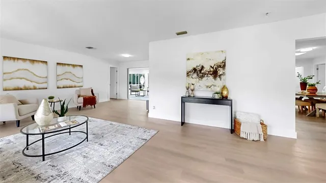 a living room with furniture and a table