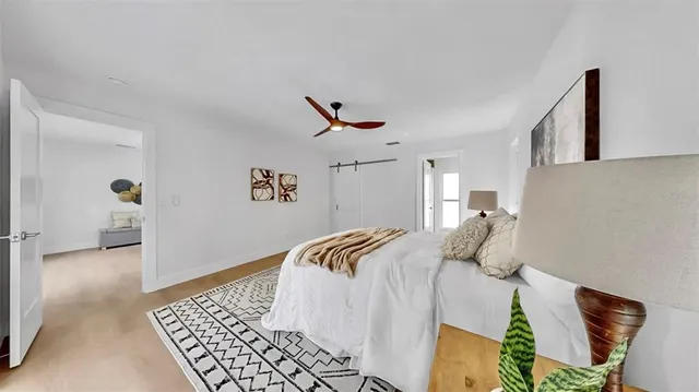 a bathroom with a bathtub shower sink and toilet