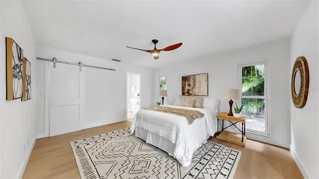 a kitchen with stove a sink and cabinets