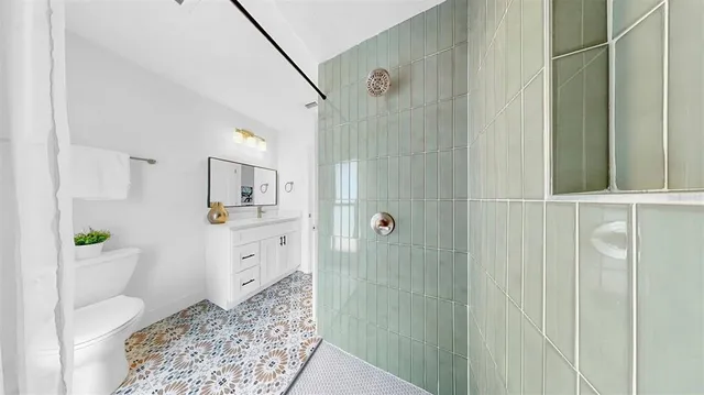 a view of a dining room with furniture and a kitchen