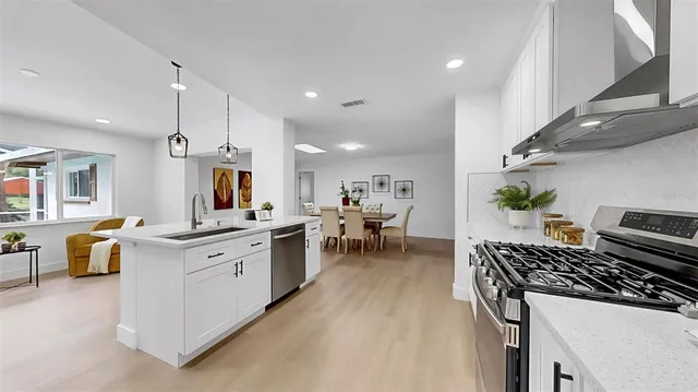 a spacious bathroom with a sink a toilet and a mirror