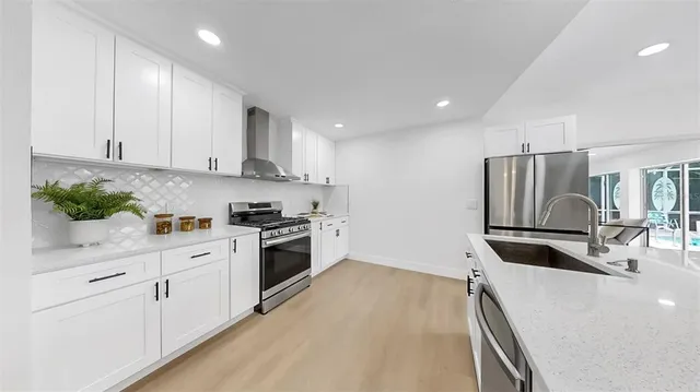 a view of a room with a ceiling fan and window
