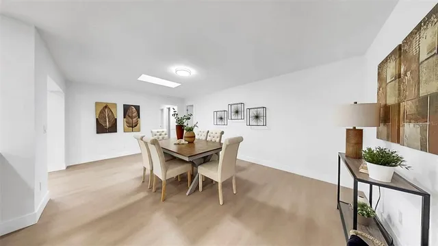 a spacious bathroom with a granite countertop sink toilet and shower