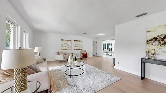 a living room with furniture and a table
