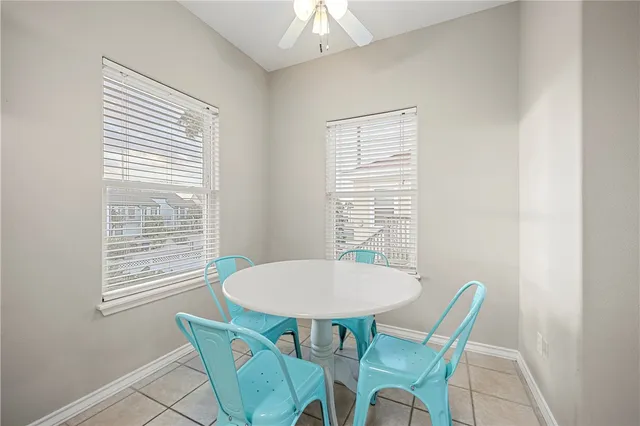 a view of a dining room with furniture and window
