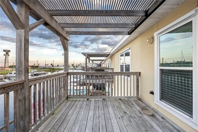 a view of a balcony with wooden floor
