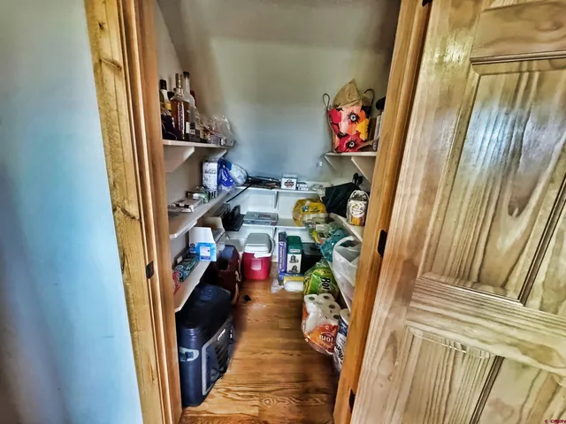 a view of a dining room with furniture wooden floor and a rug