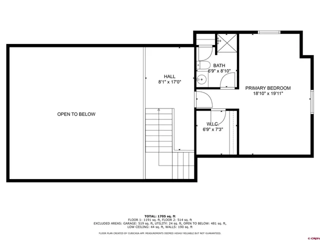 a view of a yard with plants and a large tree