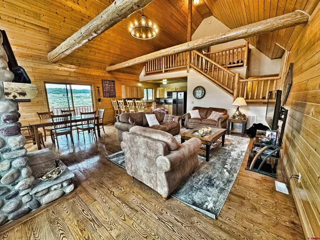 a living room with lots of furniture and a fireplace