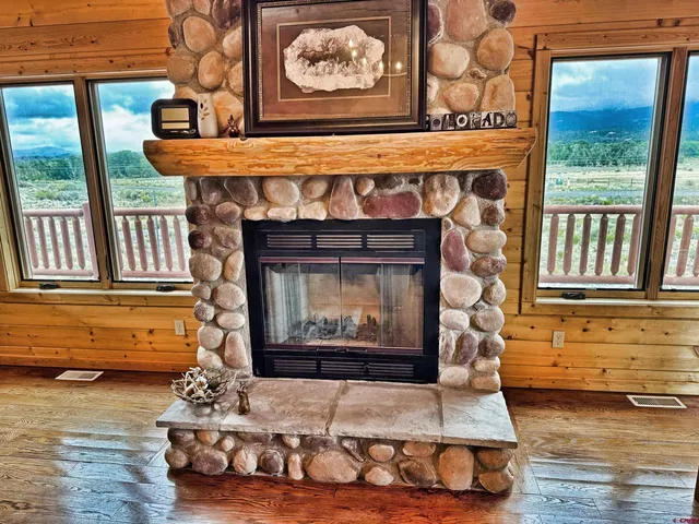 a kitchen with stainless steel appliances granite countertop wooden floors and sink