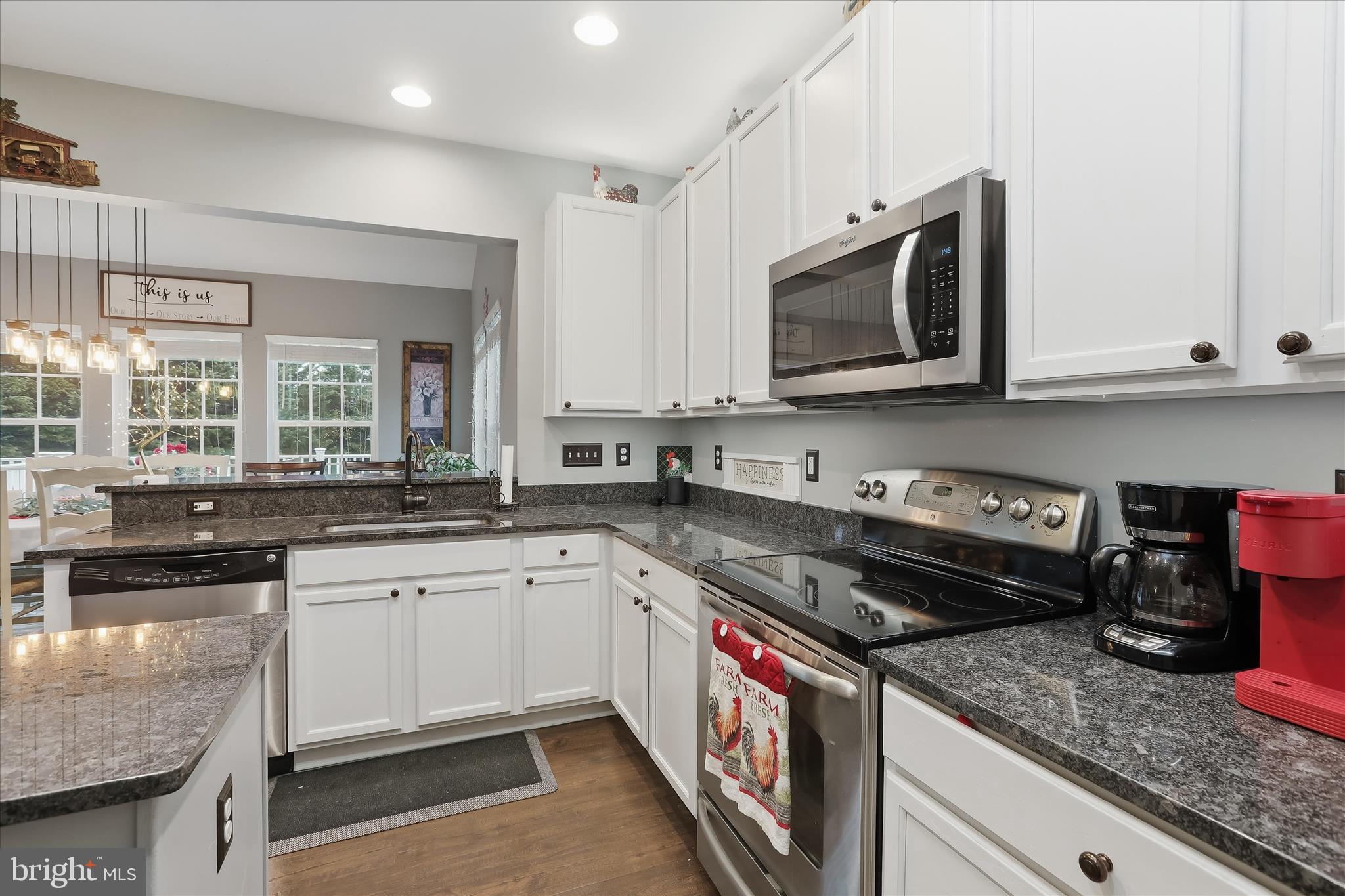 2760 Quantim Court Manchester, MD 21102 - Photo 12 of 33 a kitchen with stainless steel appliances granite countertop a stove a sink and a microwave