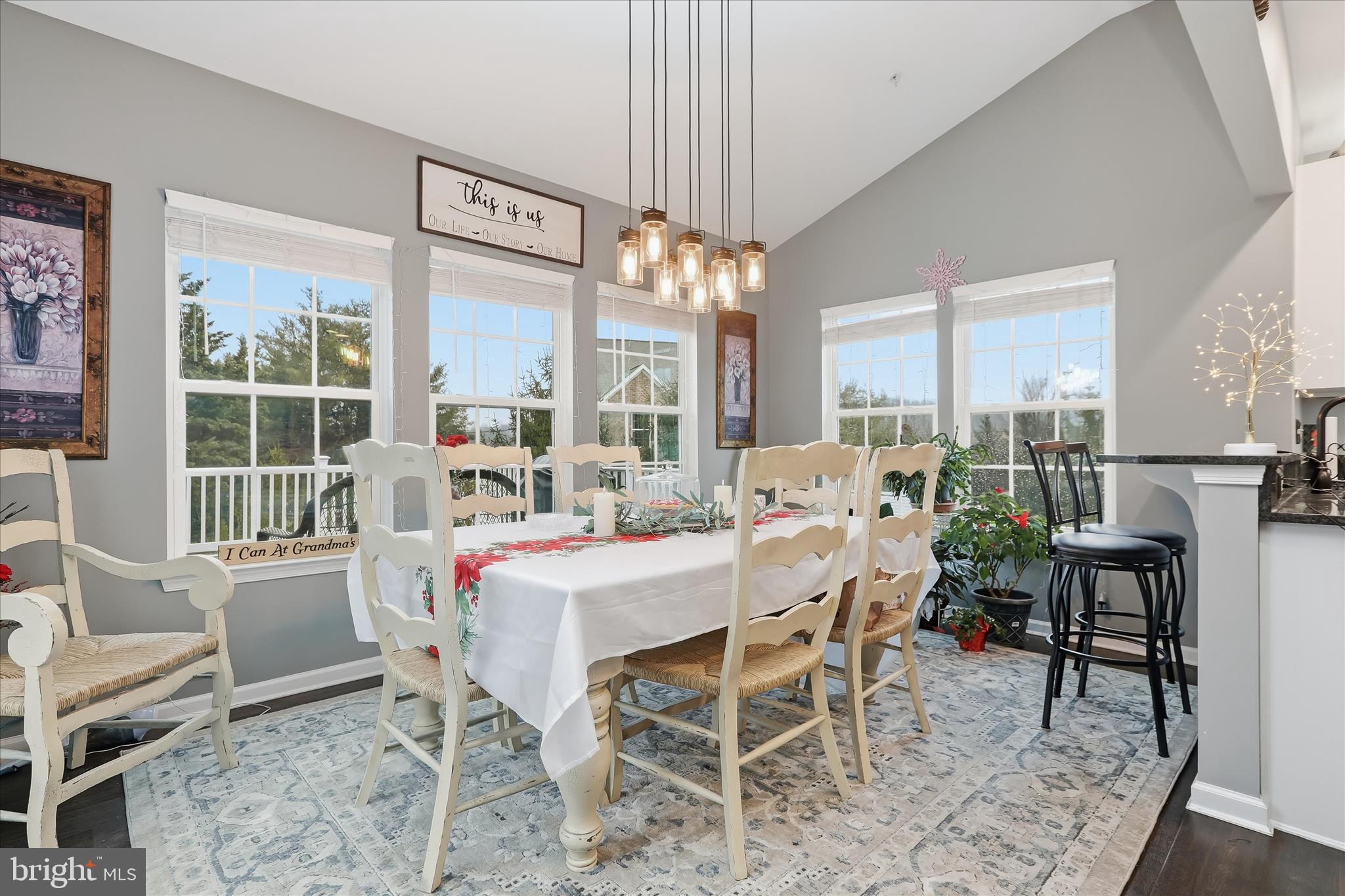 2760 Quantim Court Manchester, MD 21102 - Photo 13 of 33 a dining room with furniture a chandelier and a rug