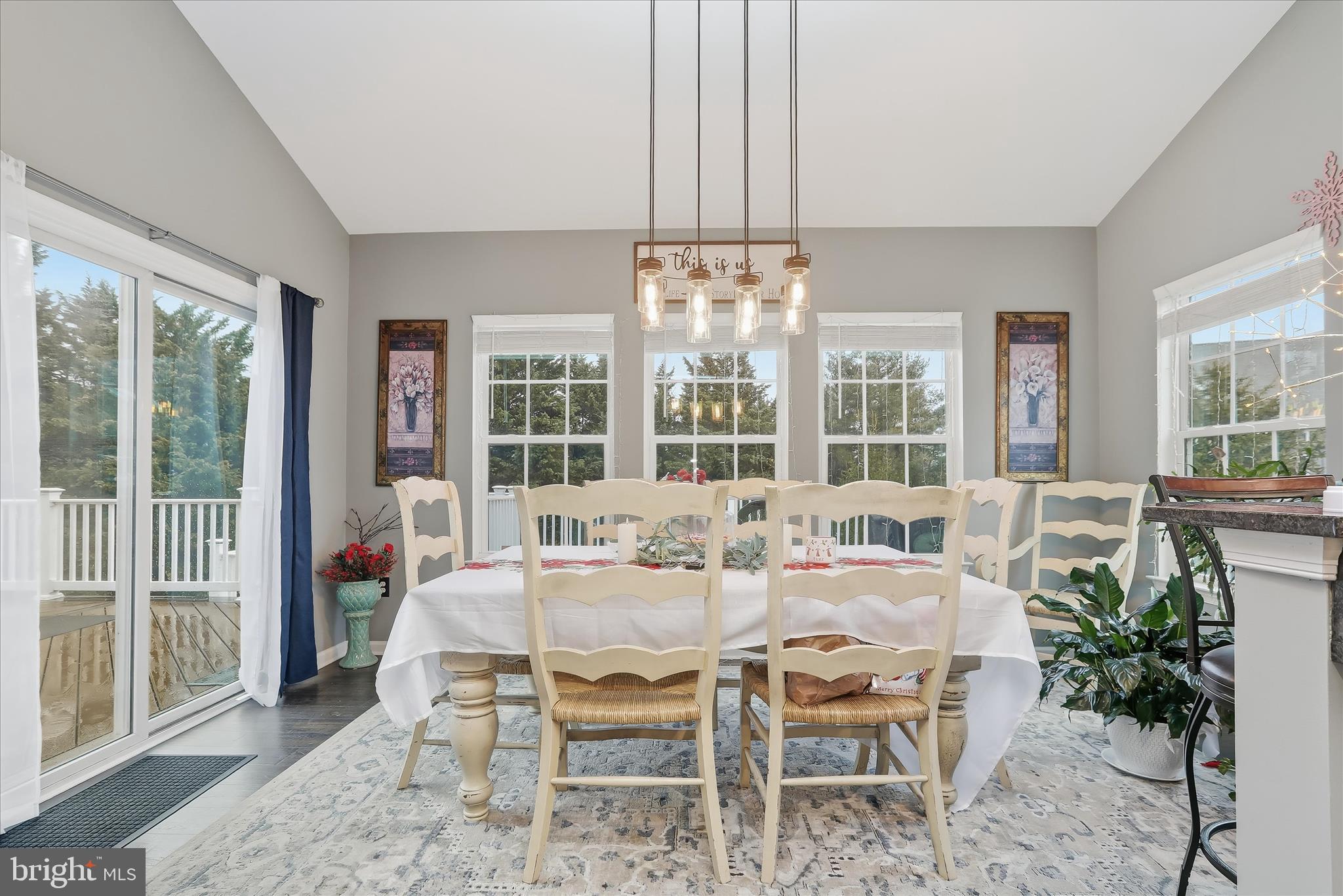 2760 Quantim Court Manchester, MD 21102 - Photo 15 of 33 a view of a dining room with furniture wooden floor and chandelier