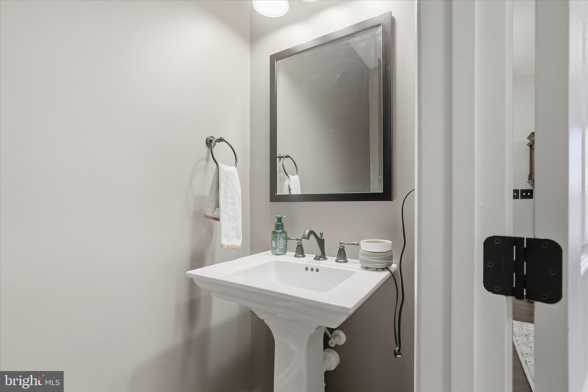 2760 Quantim Court Manchester, MD 21102 - Photo 16 of 33 a bathroom with a sink and a mirror