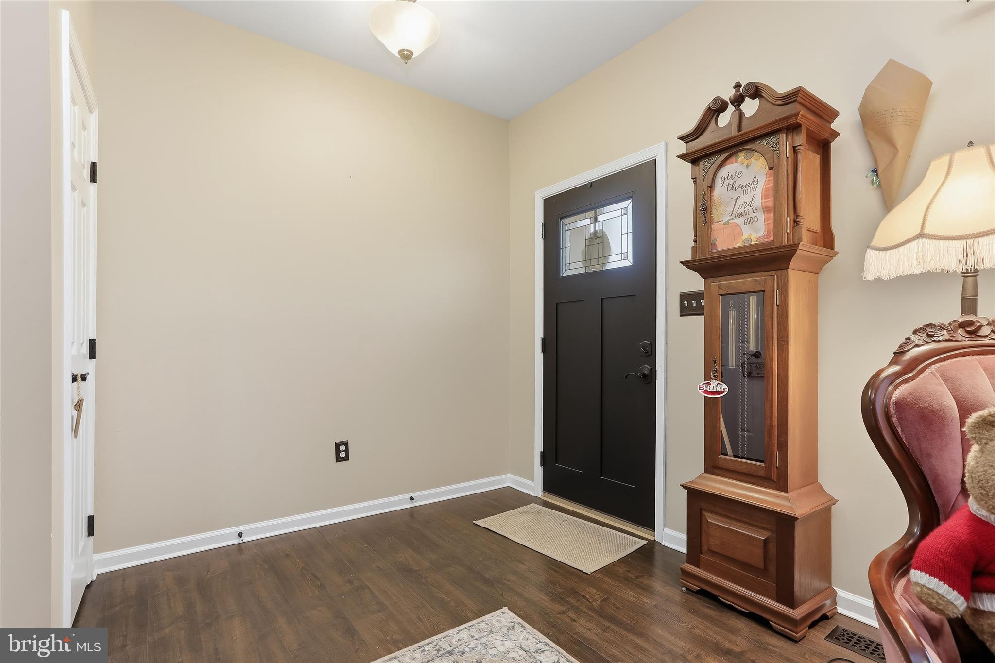 2760 Quantim Court Manchester, MD 21102 - Photo 3 of 33 a view of a hallway with entryway wooden floor and dining room view