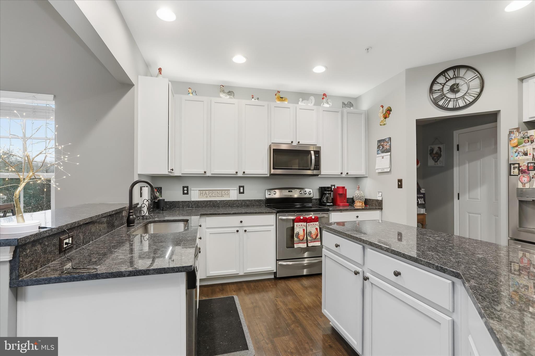2760 Quantim Court Manchester, MD 21102 - Photo 10 of 33 a kitchen with stainless steel appliances granite countertop a sink stove and cabinets