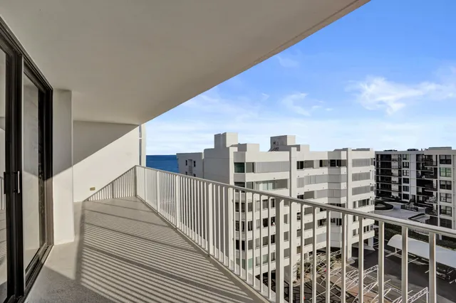 a view of a balcony with wooden floor