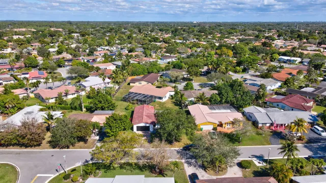 an aerial view of residential house and outdoor space