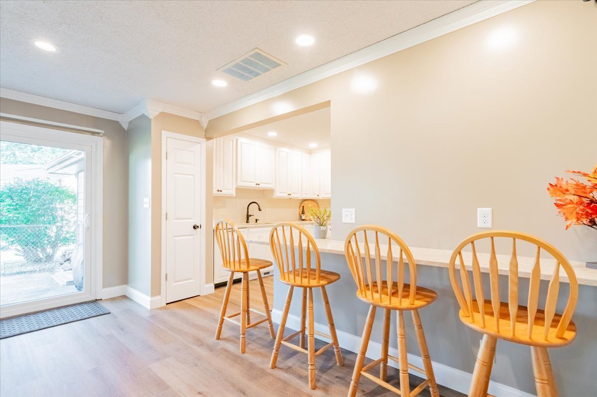 16 Holly Drive Clinton, IL 61727 - Photo 14 of 34 a view of dining room with furniture and wooden floor