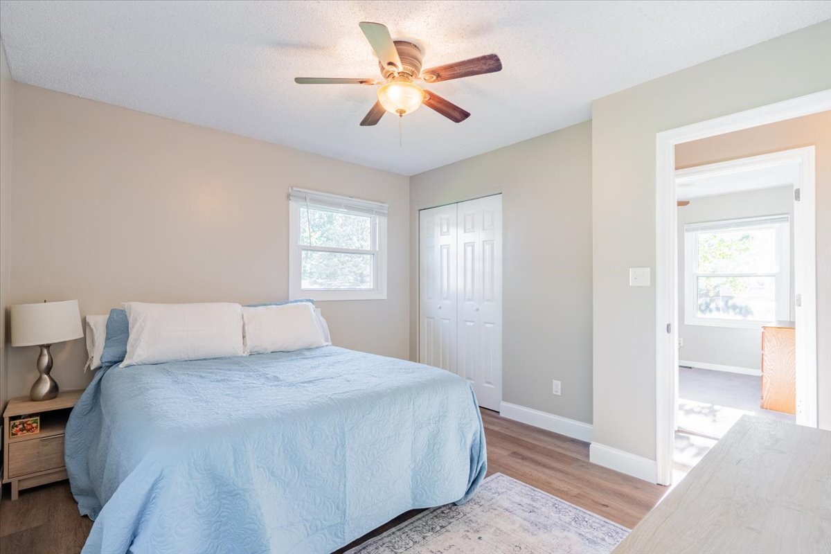 16 Holly Drive Clinton, IL 61727 - Photo 20 of 34 a bedroom with a large bed and a chandelier