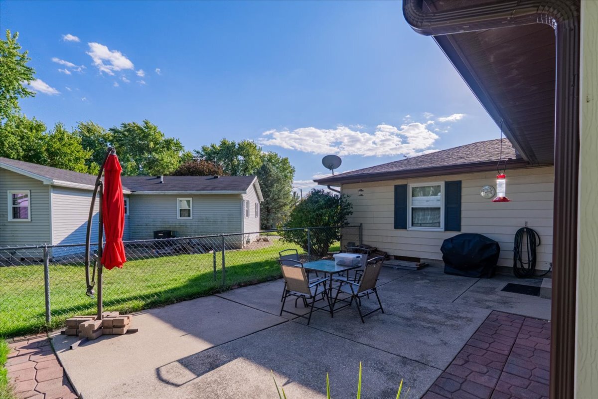 16 Holly Drive Clinton, IL 61727 - Photo 28 of 34 a view of a house with backyard and a tree