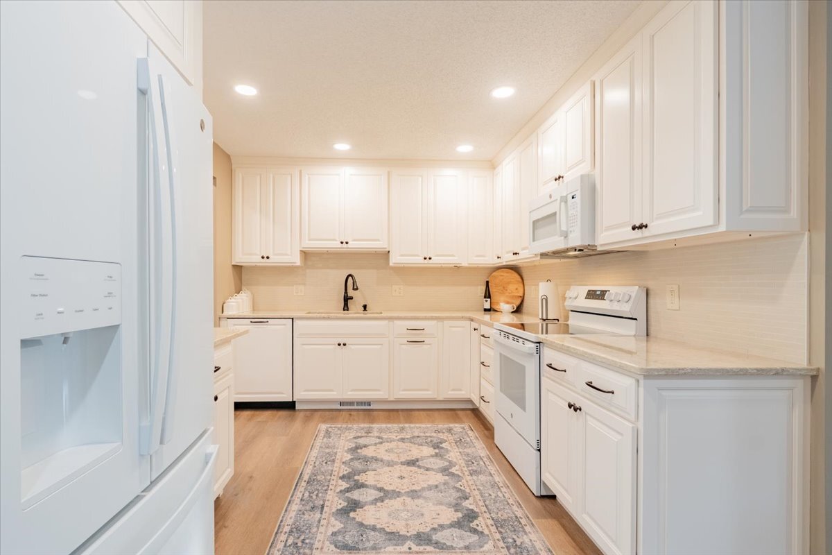 16 Holly Drive Clinton, IL 61727 - Photo 3 of 34 a kitchen with cabinets oven and a sink