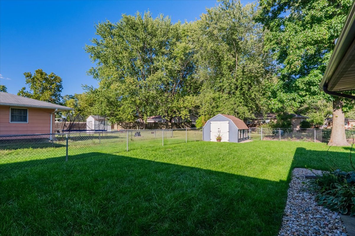 16 Holly Drive Clinton, IL 61727 - Photo 33 of 34 a view of a large garden with plants and large trees