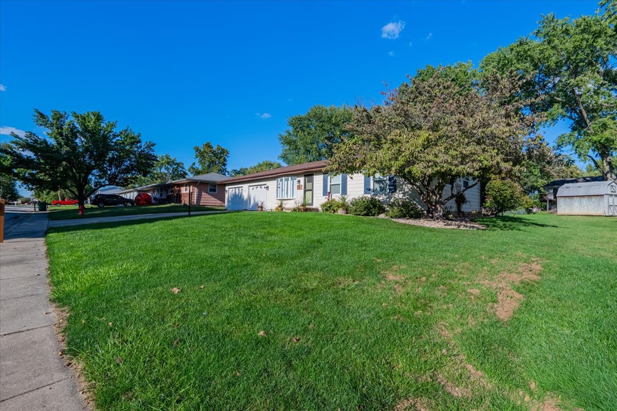 16 Holly Drive Clinton, IL 61727 - Photo 4 of 34 a view of green field with house in the background
