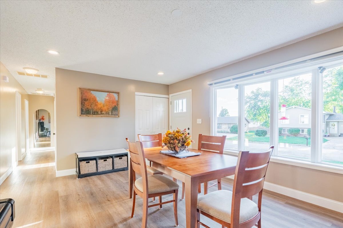 16 Holly Drive Clinton, IL 61727 - Photo 8 of 34 a view of a dining room with furniture and wooden floor