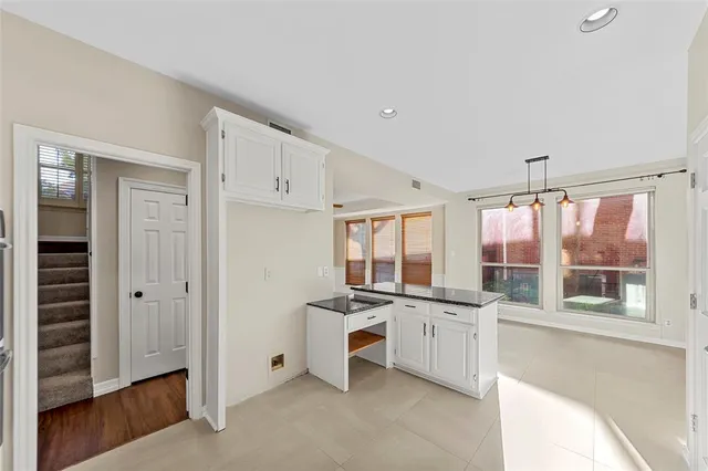 a kitchen with stainless steel appliances a sink stove and cabinets