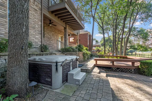 a view of outdoor sitting space with wooden benches