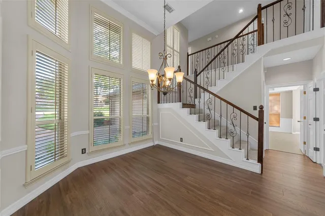 a view of an entryway with wooden floor
