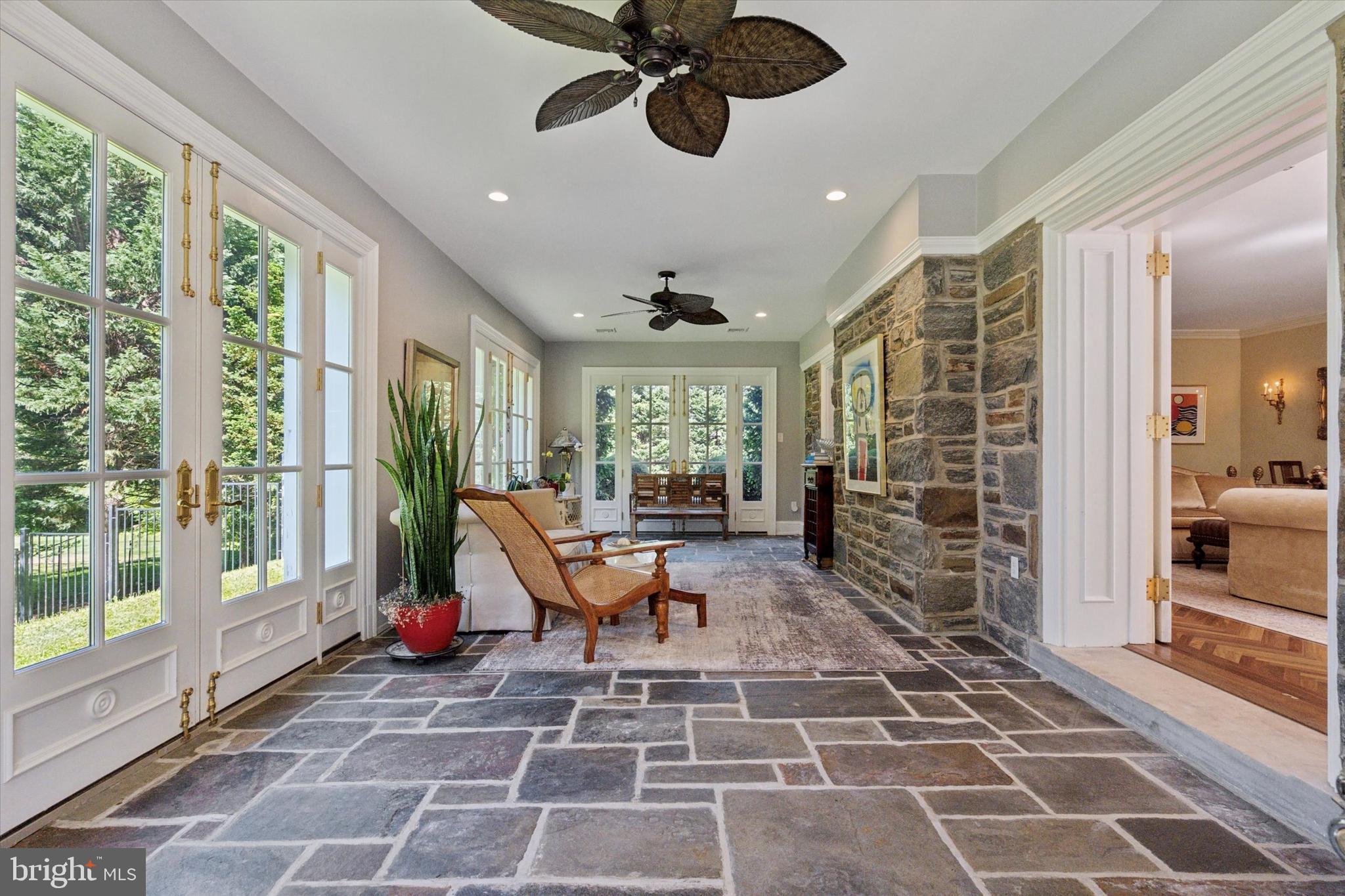 281 Winding Way Merion Station, PA 19066 - Photo 12 of 52 a living room with patio furniture and a floor to ceiling window