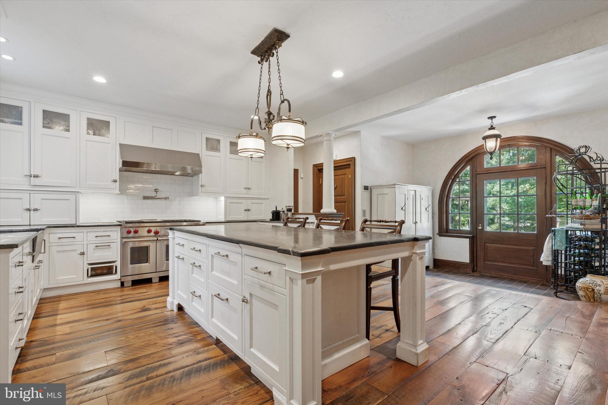 281 Winding Way Merion Station, PA 19066 - Photo 14 of 52 a kitchen with stainless steel appliances granite countertop a stove and cabinets