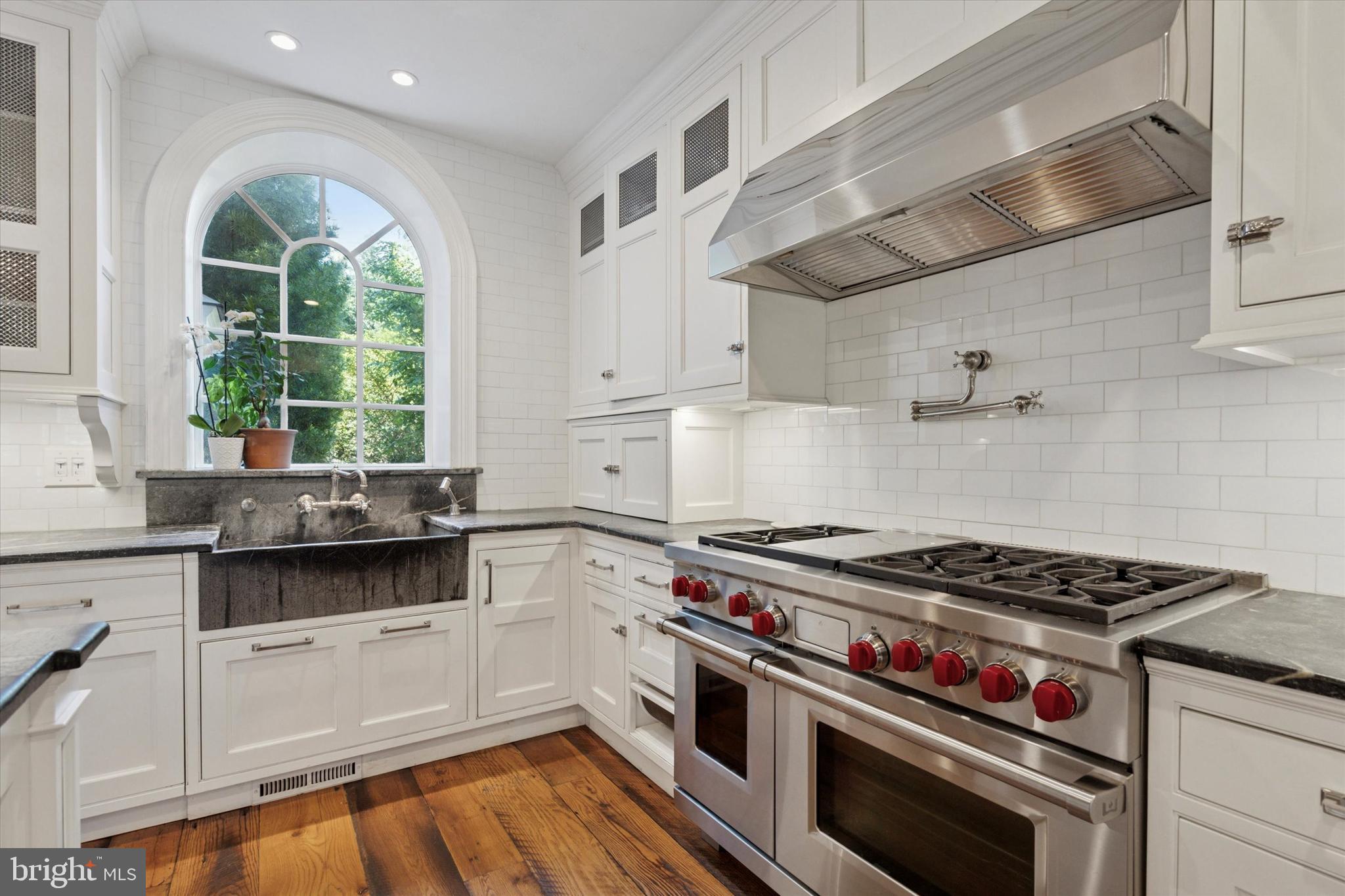 281 Winding Way Merion Station, PA 19066 - Photo 16 of 52 a kitchen with stainless steel appliances a stove a sink and cabinets