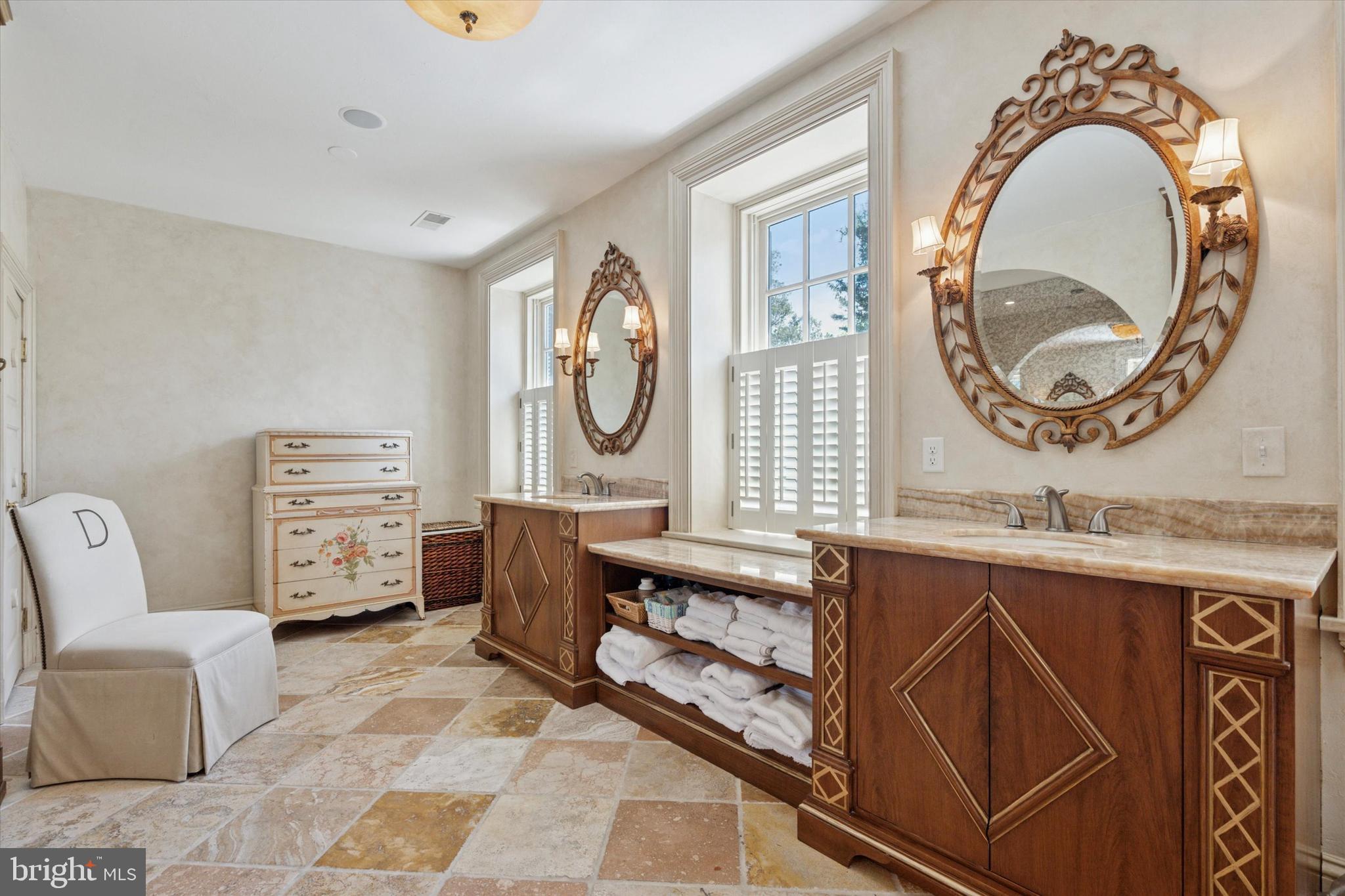 281 Winding Way Merion Station, PA 19066 - Photo 23 of 52 a living room with furniture a mirror and a clock on the table