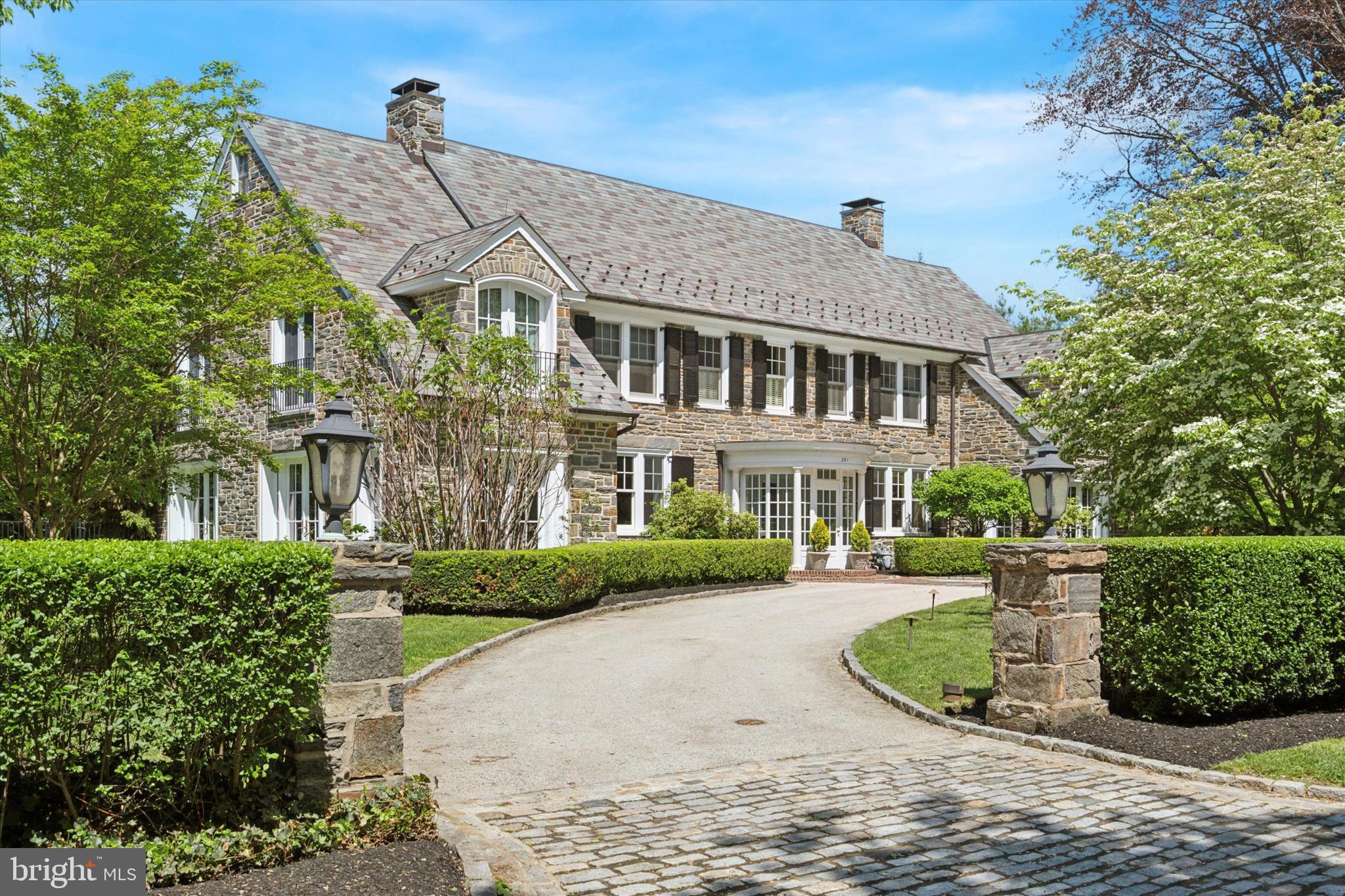 281 Winding Way Merion Station, PA 19066 - Photo 3 of 52 front view of a house with a yard