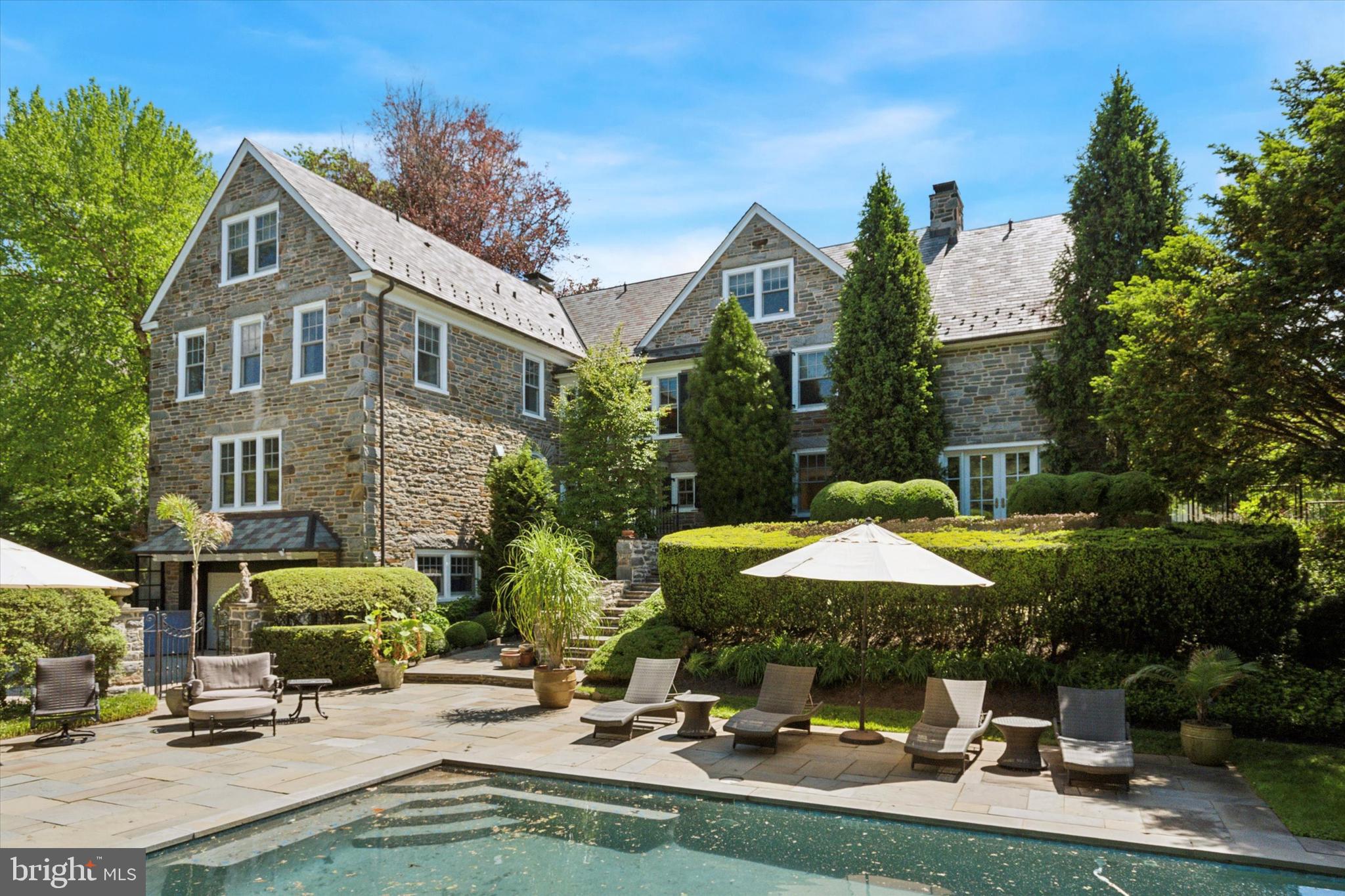 281 Winding Way Merion Station, PA 19066 - Photo 38 of 52 a front view of a house with swimming pool and sitting area