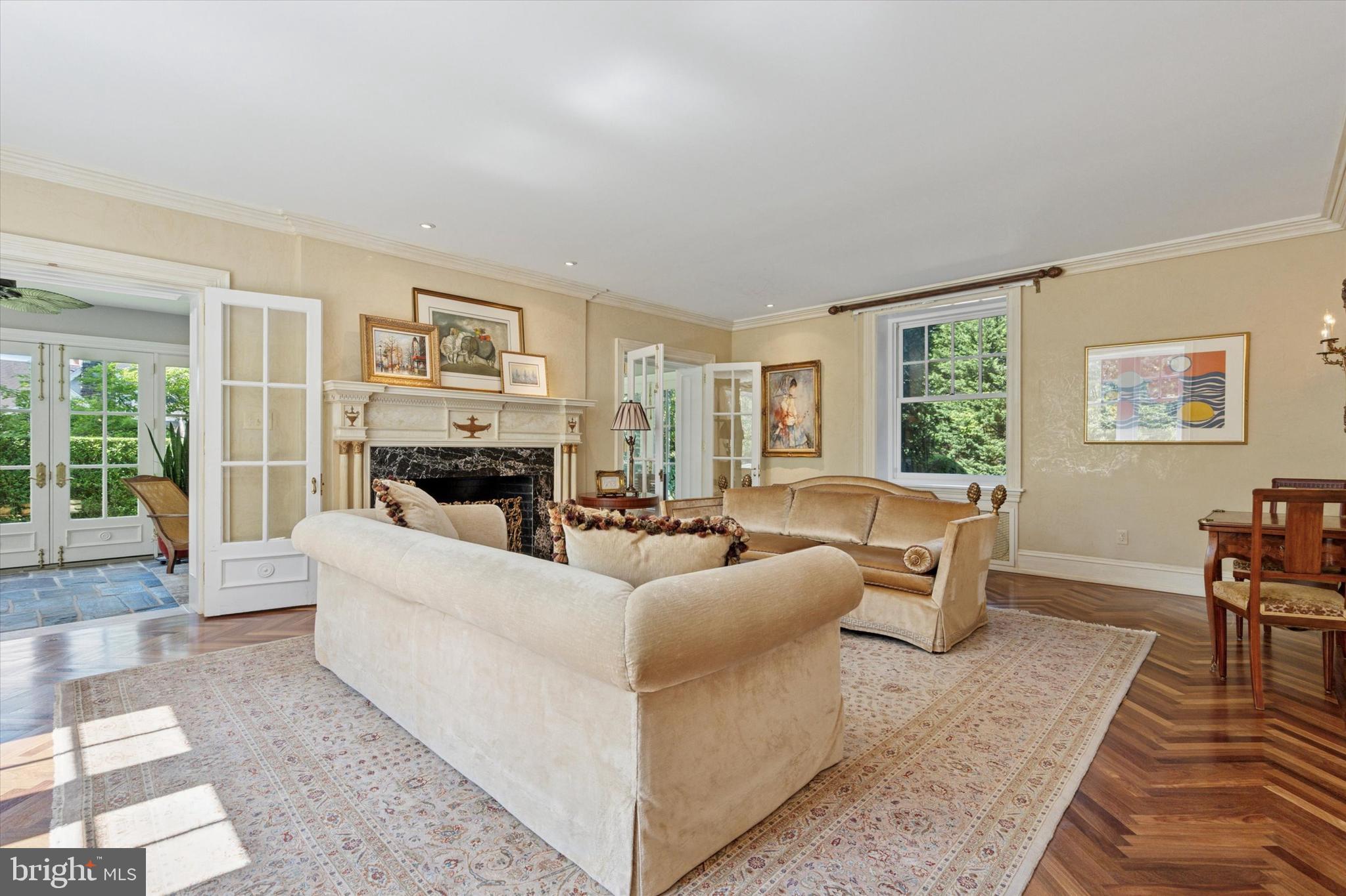 281 Winding Way Merion Station, PA 19066 - Photo 10 of 52 a living room with furniture a large window and a fireplace