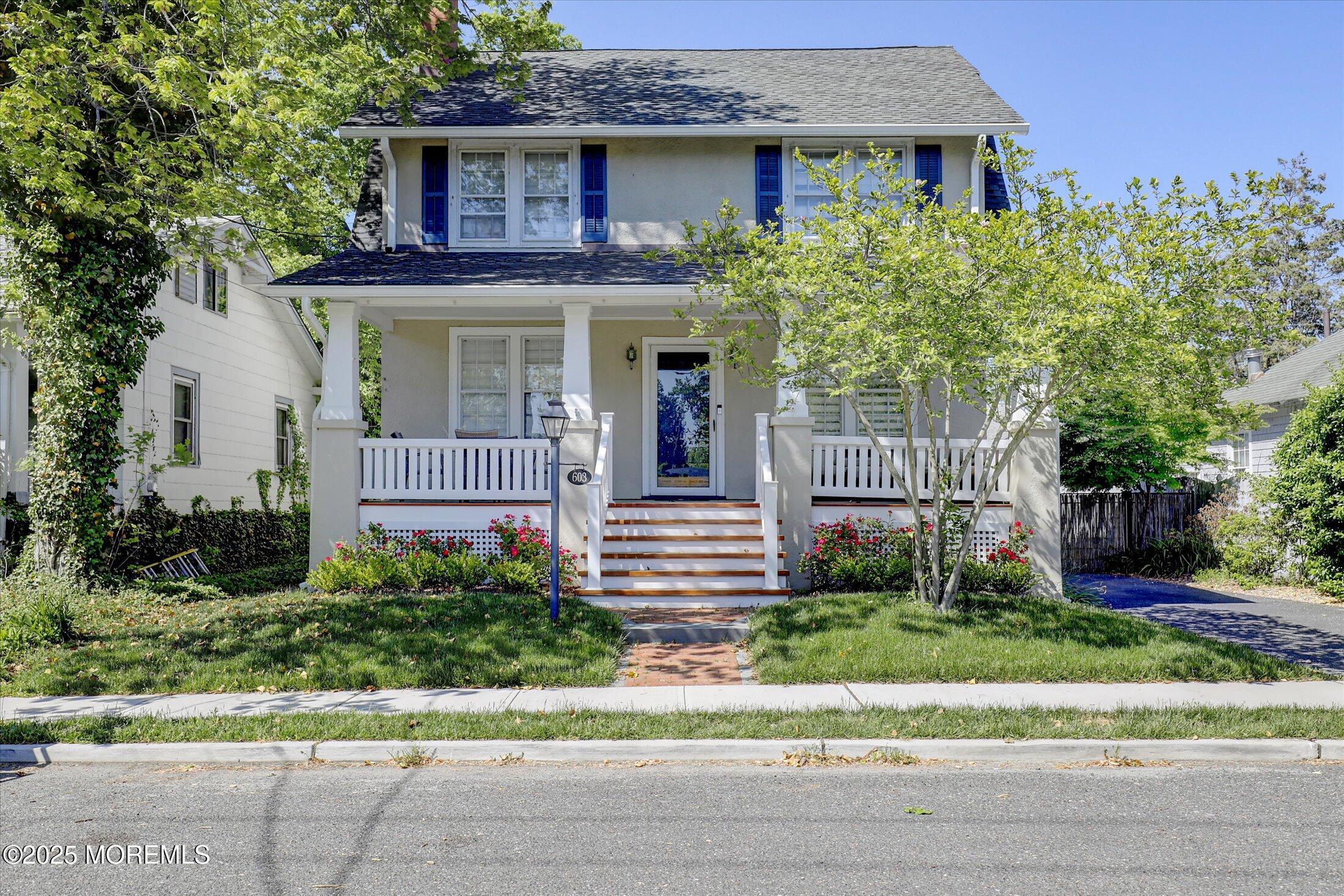 603 Laurel Avenue West Allenhurst, NJ 07711 - Photo 1 of 67 a front view of a house with a garden